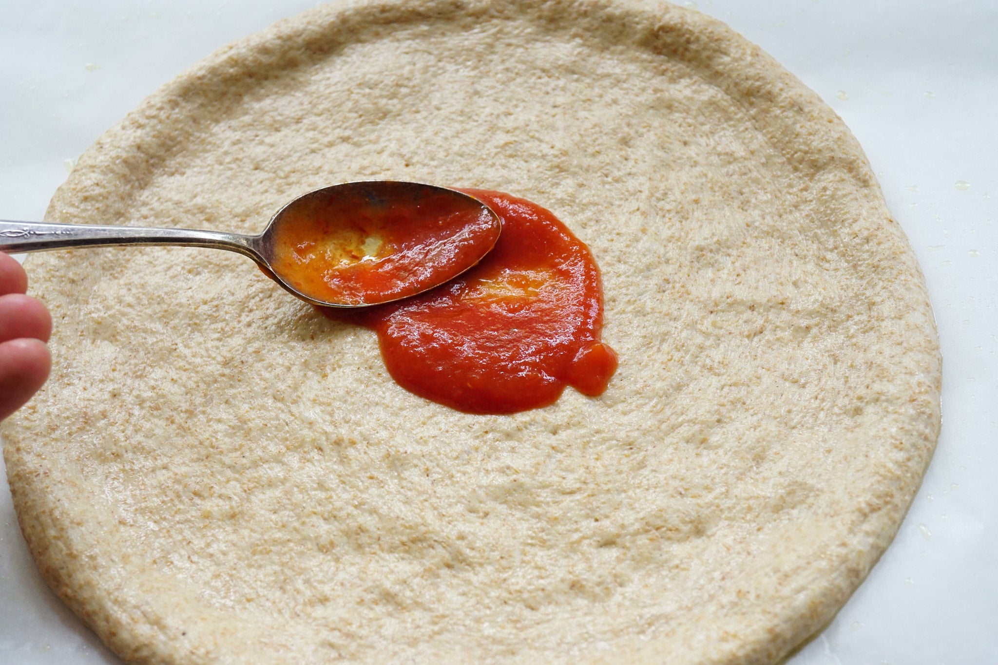 Kernza pizza dough with sauce